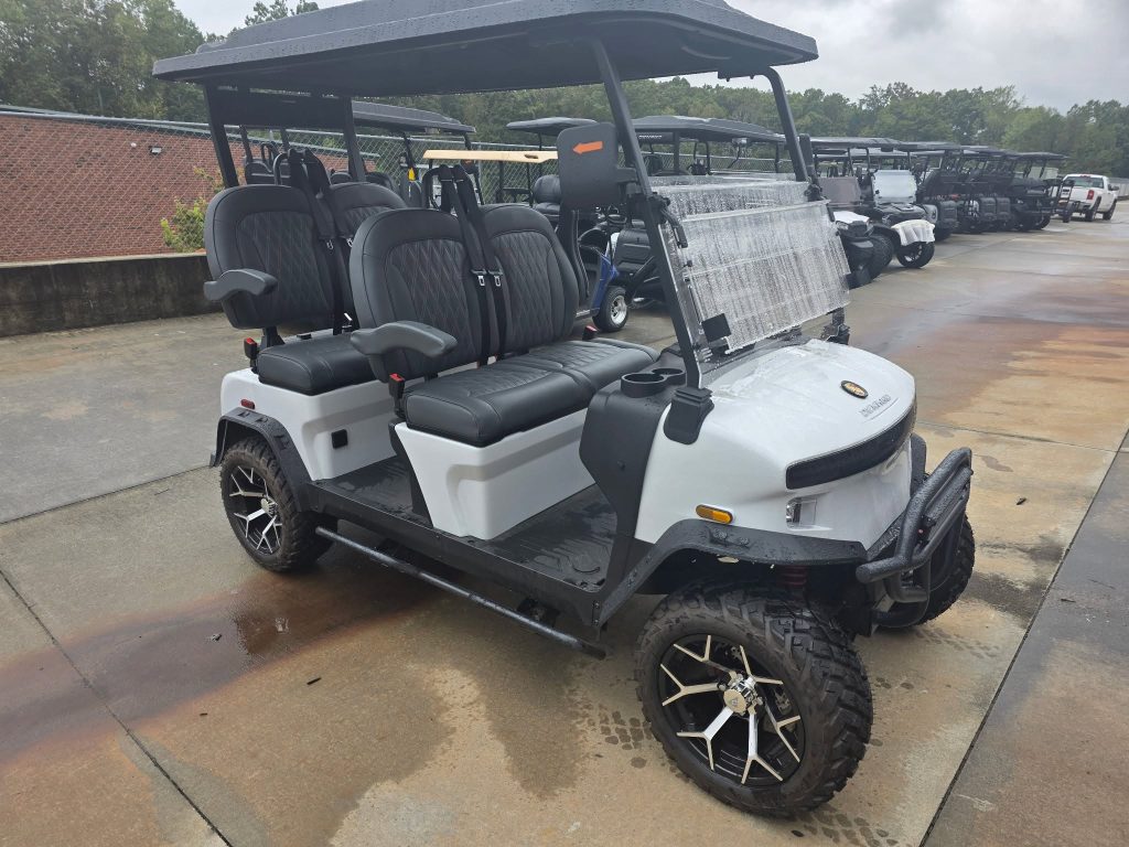 White Denago lifted 4-passenger golf cart